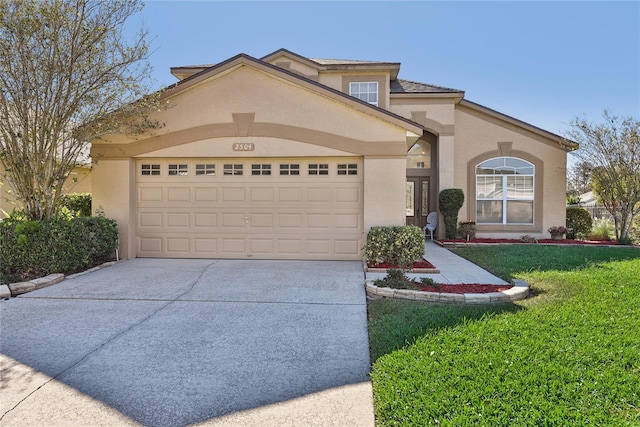 mediterranean / spanish home featuring a front lawn