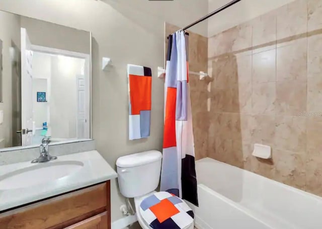 full bathroom featuring shower / bath combo, toilet, and large vanity