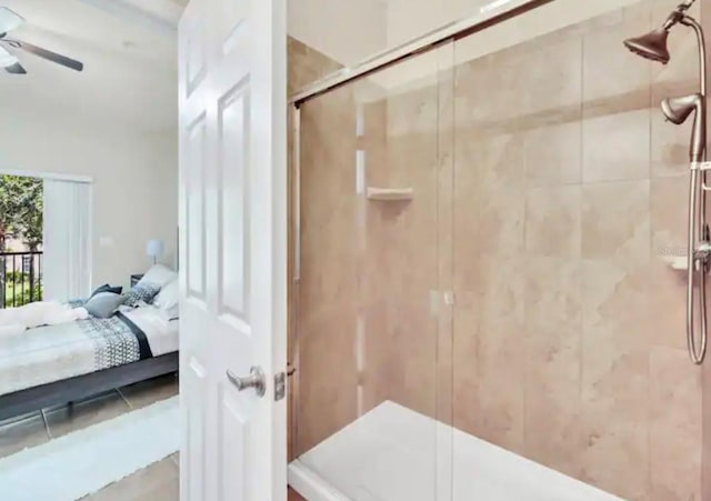 bathroom with ceiling fan and a shower with shower door