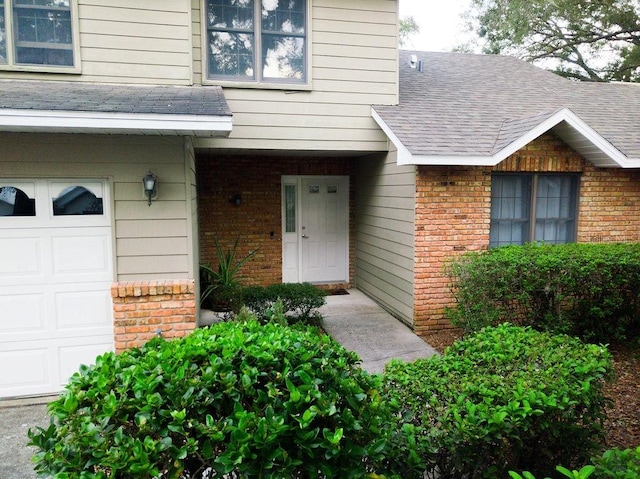 property entrance with a garage