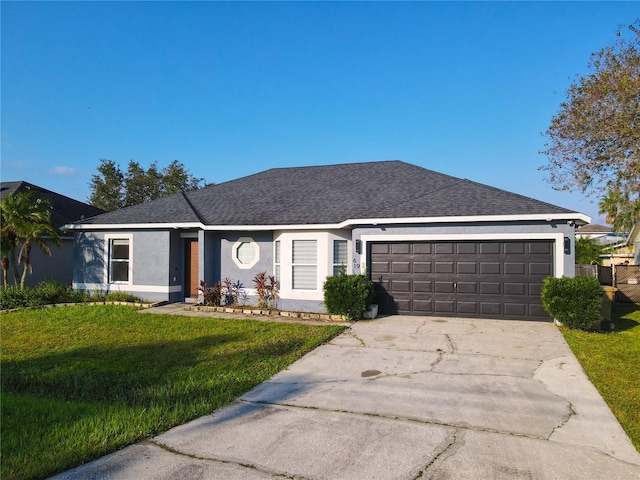 ranch-style home with a front lawn and a garage