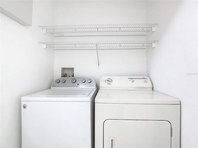 laundry room featuring washer and clothes dryer