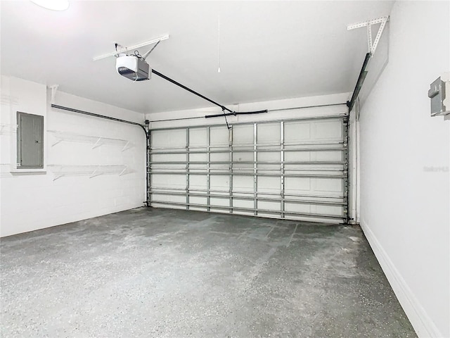 garage with a garage door opener and electric panel