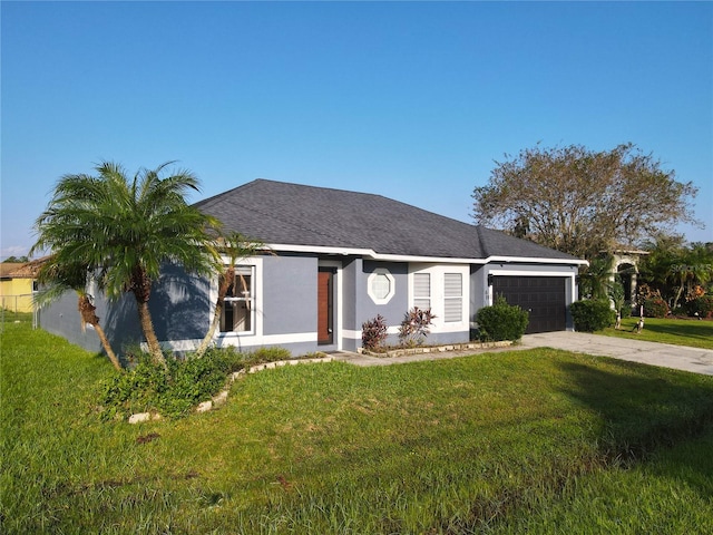 ranch-style home featuring a front lawn and a garage