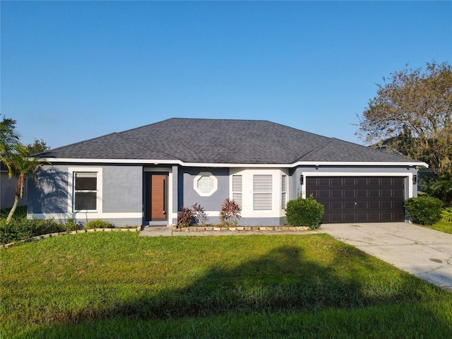 ranch-style home featuring a front lawn and a garage