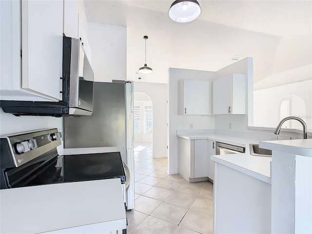 kitchen with white cabinetry, stainless steel appliances, and hanging light fixtures