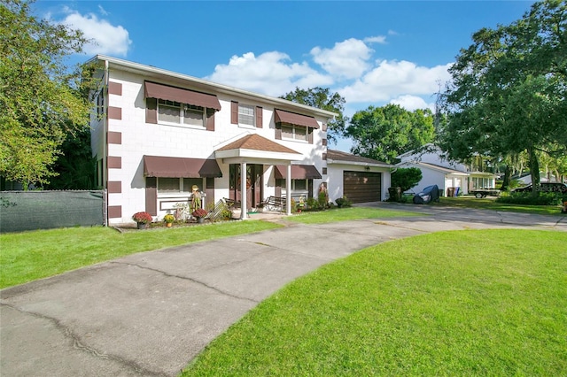 view of front of house featuring a front yard and a garage