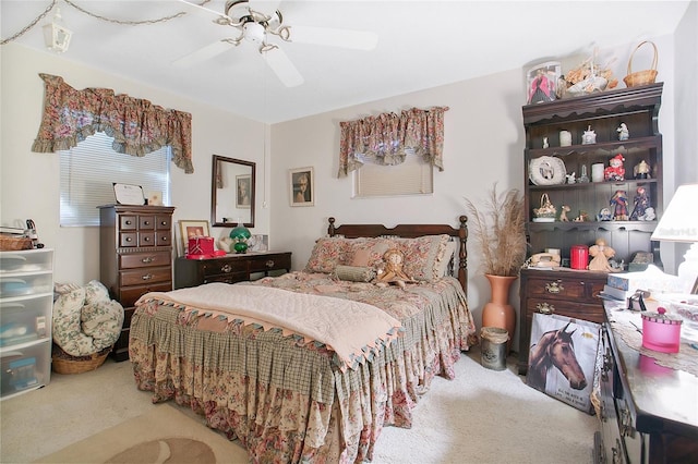 bedroom featuring light carpet and ceiling fan