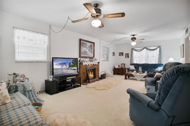 living room with ceiling fan and light colored carpet