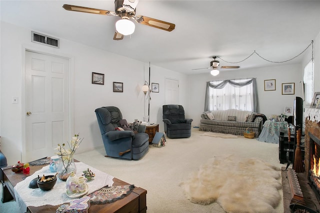 living room with carpet and ceiling fan