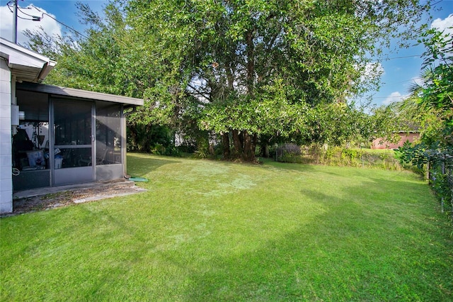 view of yard featuring a sunroom