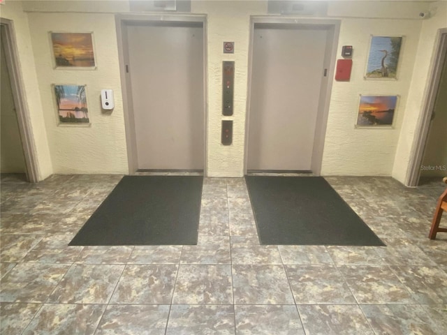 interior space featuring tile flooring and elevator