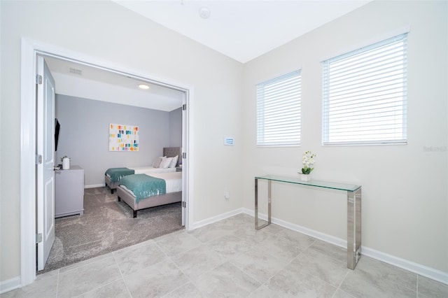 bedroom with light colored carpet