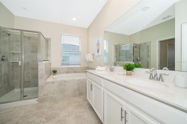 bathroom featuring shower with separate bathtub, dual bowl vanity, and tile flooring