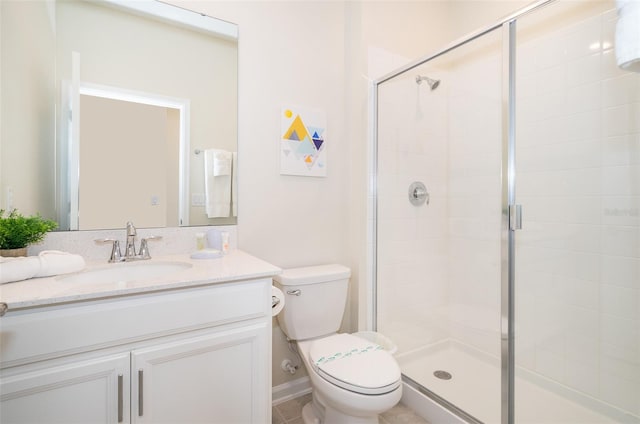 bathroom with an enclosed shower, tile floors, large vanity, and toilet