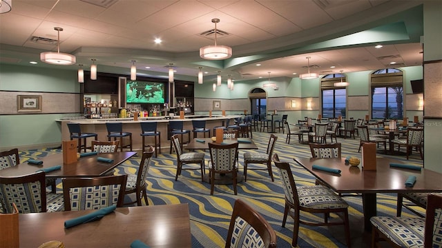 dining room with a drop ceiling