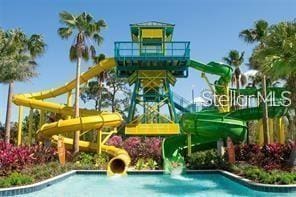 view of swimming pool featuring a water slide