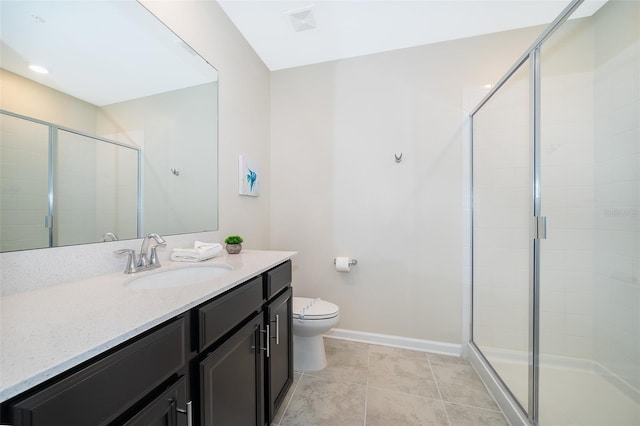 bathroom featuring vanity, tile flooring, a shower with shower door, and toilet