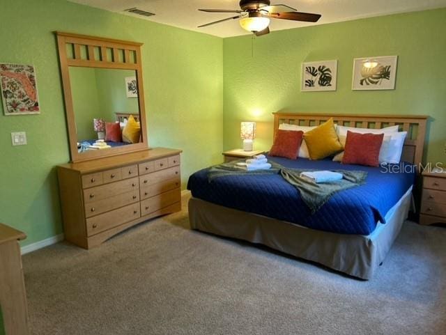 carpeted bedroom featuring ceiling fan