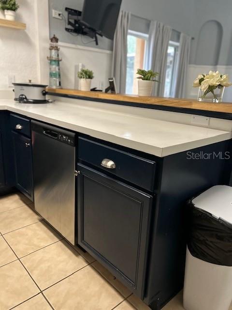 kitchen with dishwasher and light tile patterned floors