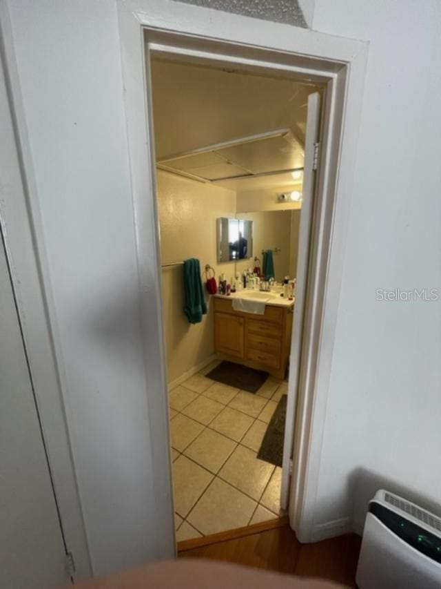 bathroom with tile patterned flooring and vanity