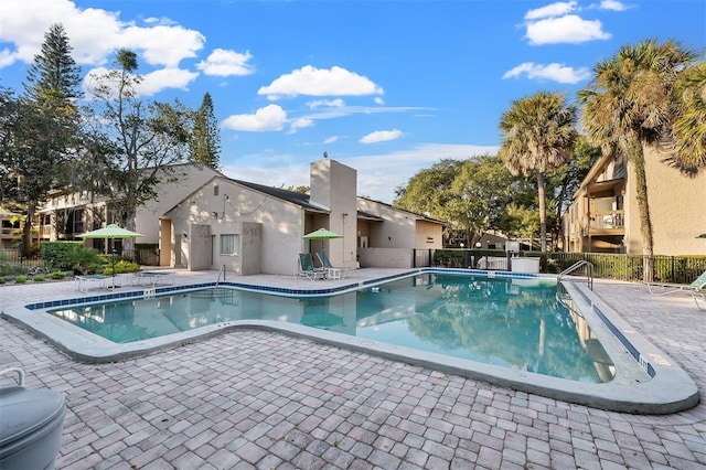 view of swimming pool featuring a patio area