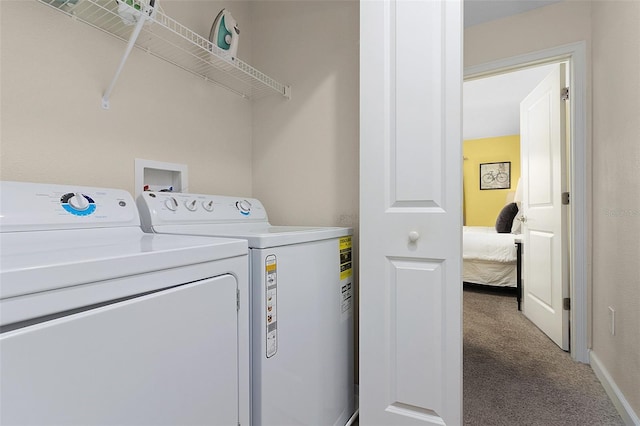 laundry area with washer hookup, washing machine and dryer, and carpet floors