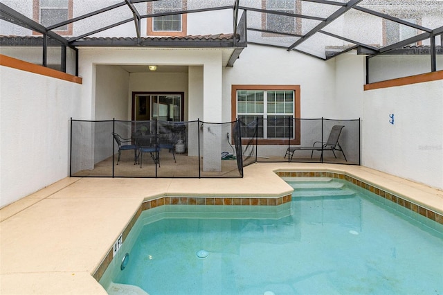 view of pool with a hot tub