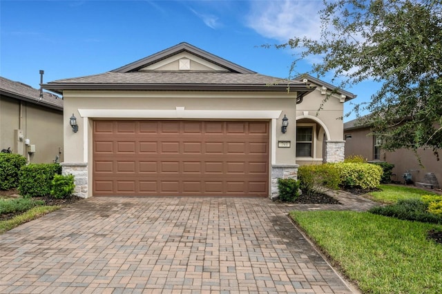 single story home featuring a garage