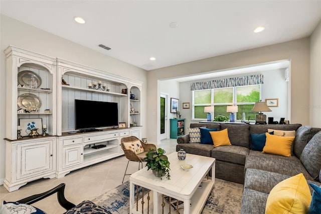 living room featuring light tile flooring