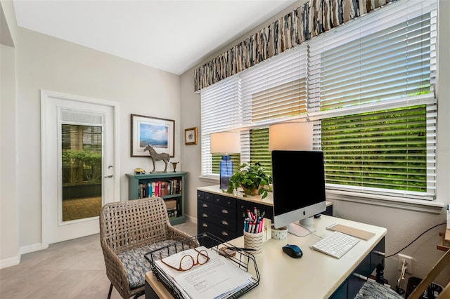 office space with a healthy amount of sunlight and light tile floors