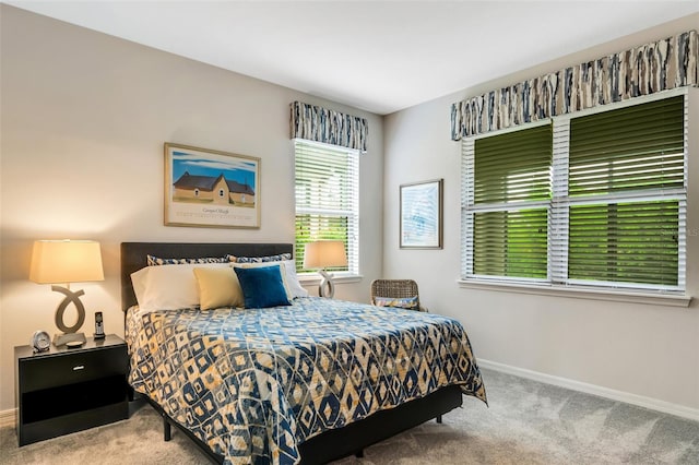 bedroom with light colored carpet