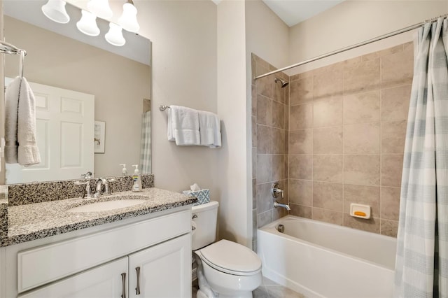 full bathroom featuring shower / bath combination with curtain, vanity with extensive cabinet space, and toilet