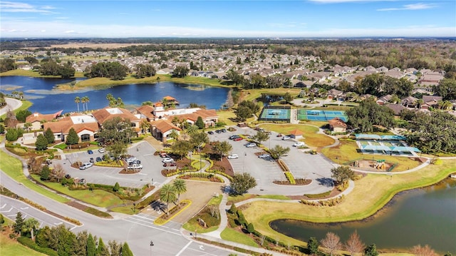 birds eye view of property with a water view