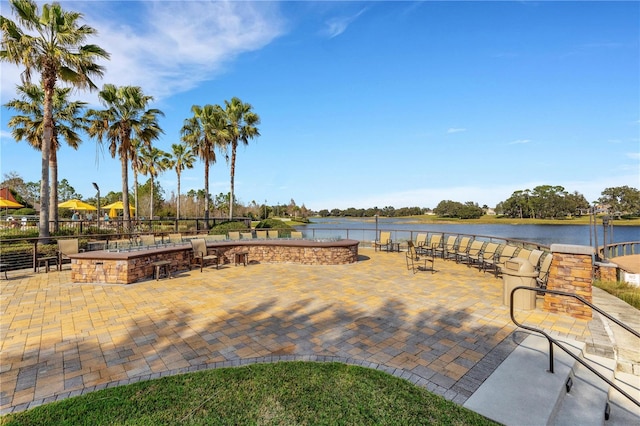 view of patio featuring a water view