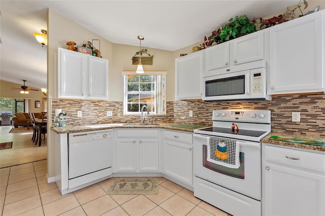 kitchen with white appliances, ceiling fan, sink, white cabinets, and tasteful backsplash