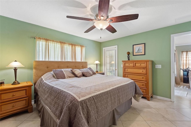 tiled bedroom with ceiling fan