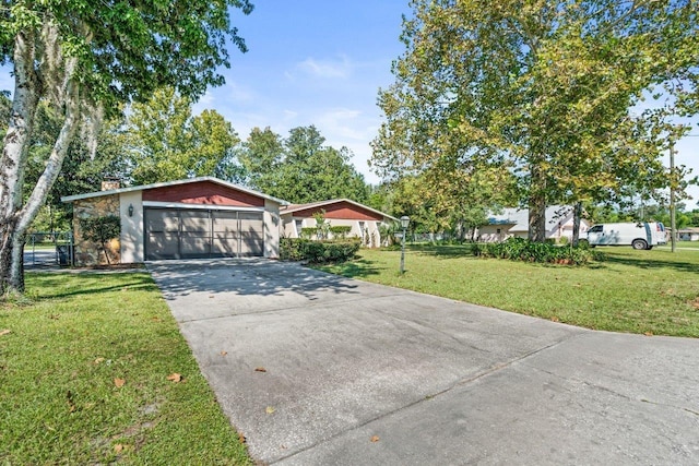 ranch-style home with a front yard and a garage