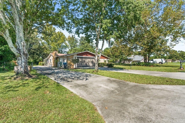 ranch-style home featuring a front yard