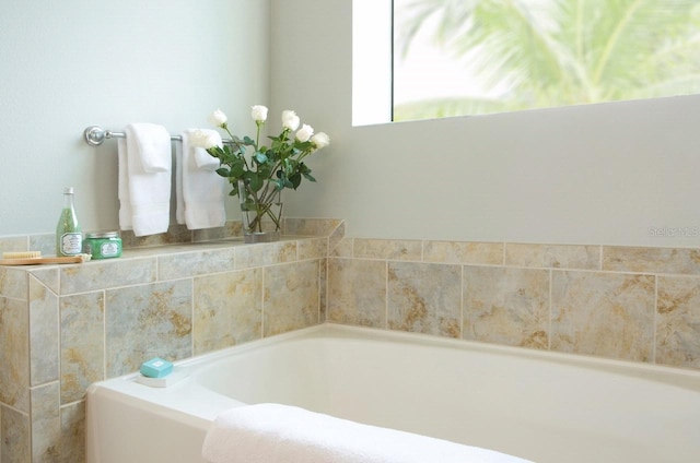 bathroom with a tub to relax in