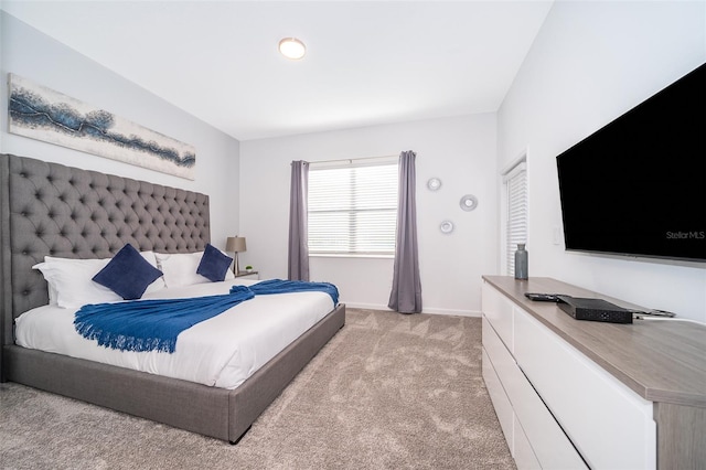 bedroom with light colored carpet