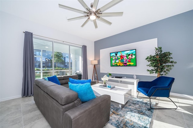 tiled living room featuring ceiling fan