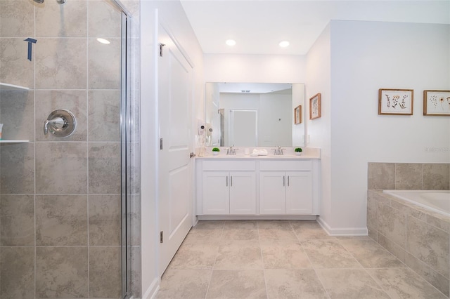 bathroom with tile flooring, large vanity, and separate shower and tub