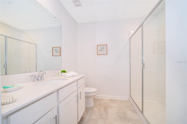 bathroom featuring vanity, tile floors, a shower with door, and toilet