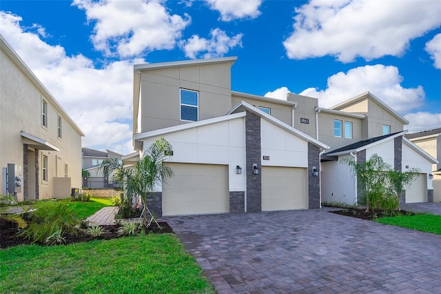 view of front of house with a front lawn and a garage