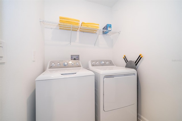 washroom with washer hookup and washer and clothes dryer