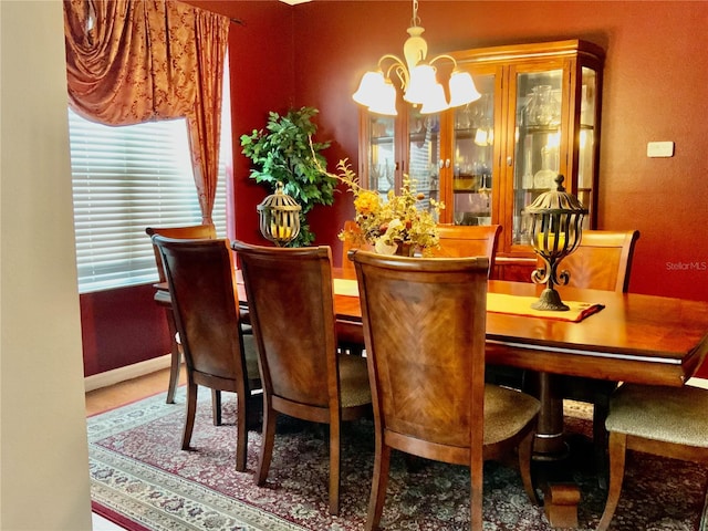 dining area featuring a notable chandelier