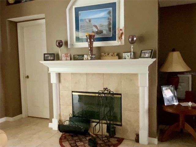 details with tile patterned floors and a tile fireplace