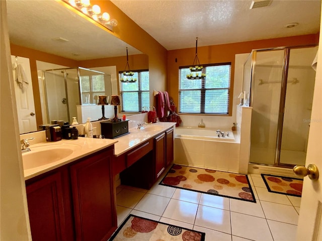 bathroom featuring a textured ceiling, independent shower and bath, vanity, and an inviting chandelier