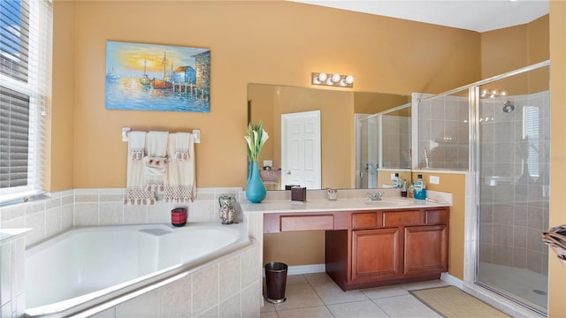 bathroom featuring tile patterned floors, independent shower and bath, plenty of natural light, and vanity